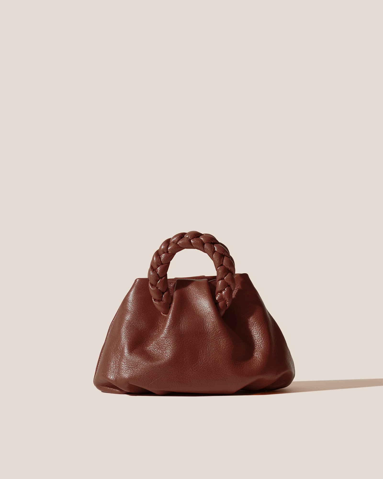 BOMBON SUPPLE SHINY - Plaited-handle Leather Handbag - Hereu US
