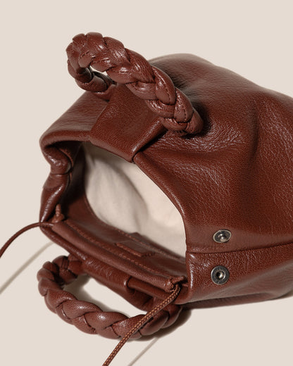 BOMBON SUPPLE SHINY - Plaited-handle Leather Handbag - Hereu US